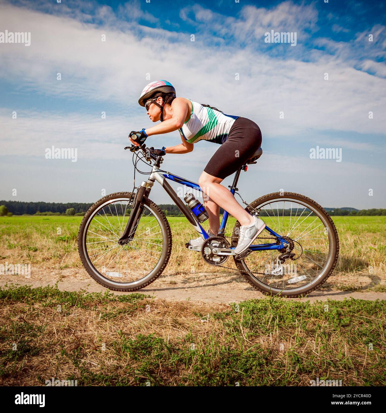 Women on the nature of riding a bike Stock Photo - Alamy