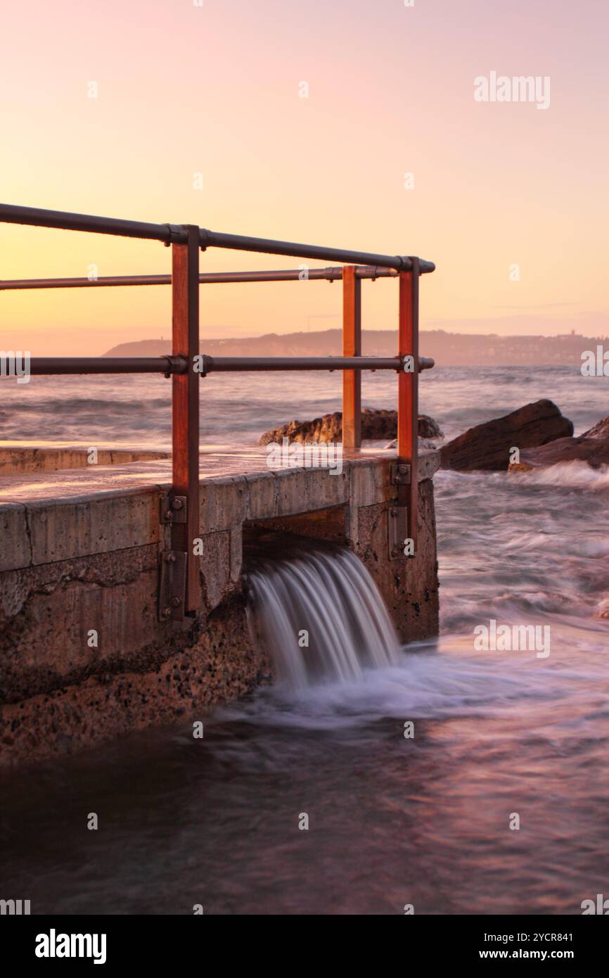 North Rocks Over Flow North Curl Curl rock pool overflow just before the sunrise Stock Photo ...