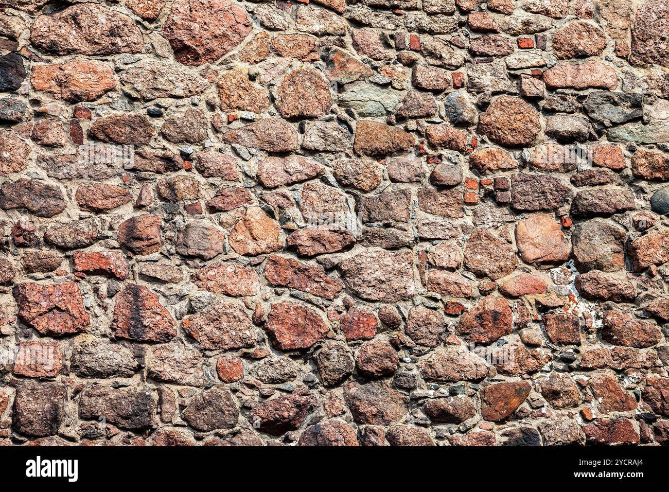 Rough natural old stone wall as background Stock Photo
