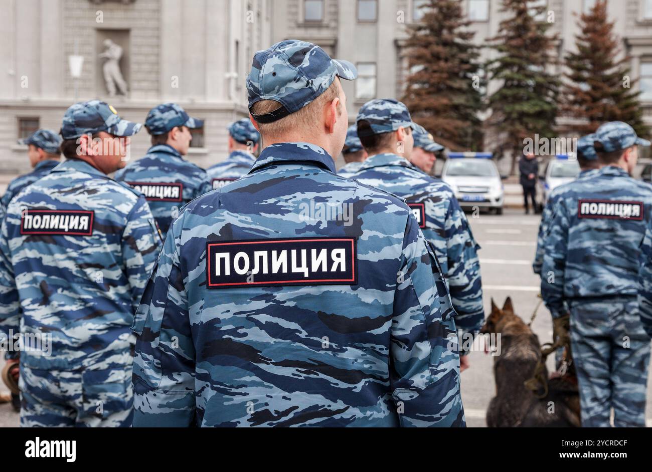 Russian Cop Russian police unit in uniform with police dogs on the Kuibyshev square ...