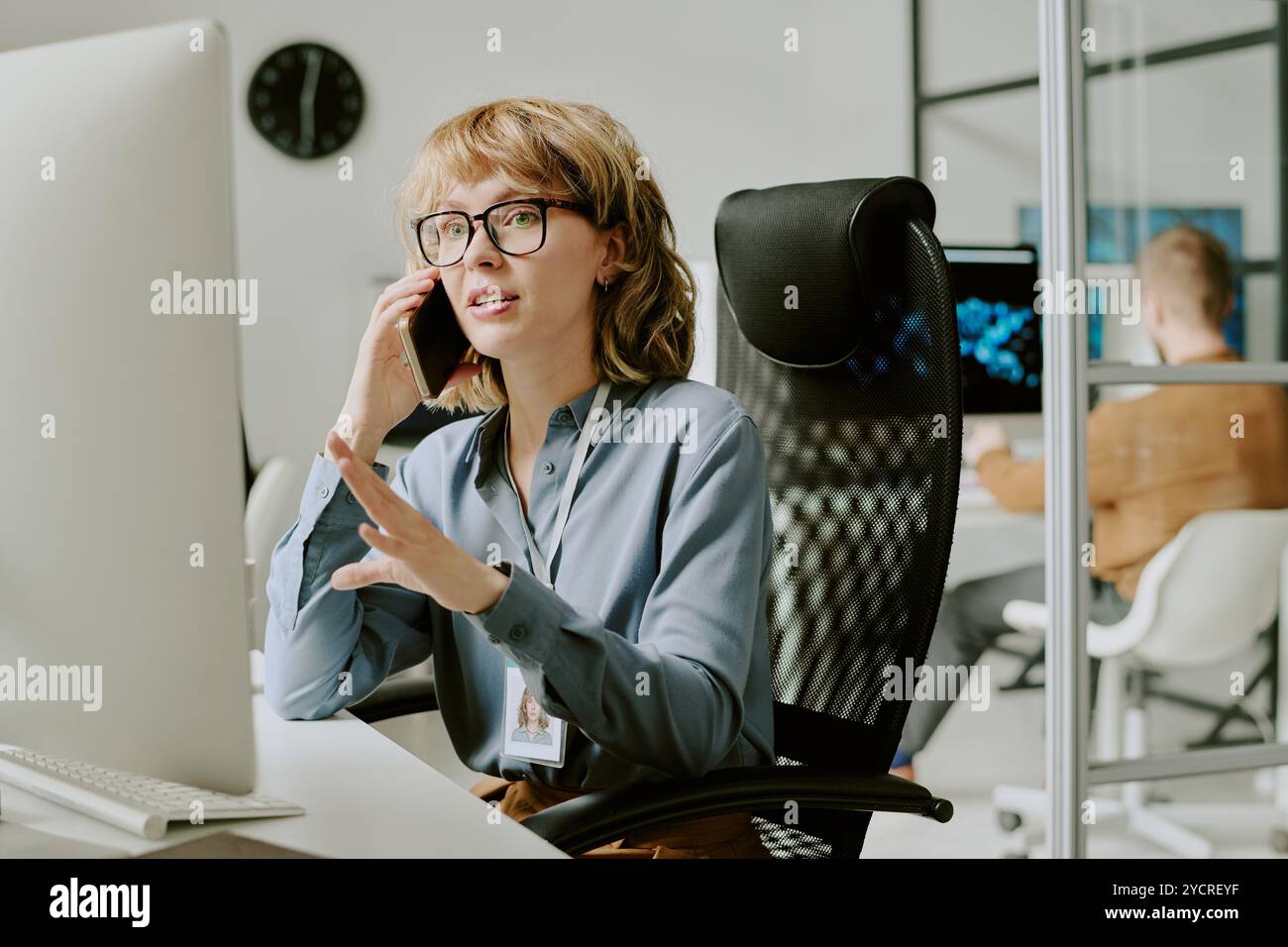 Female Manager Talking on Phone Stock Photo