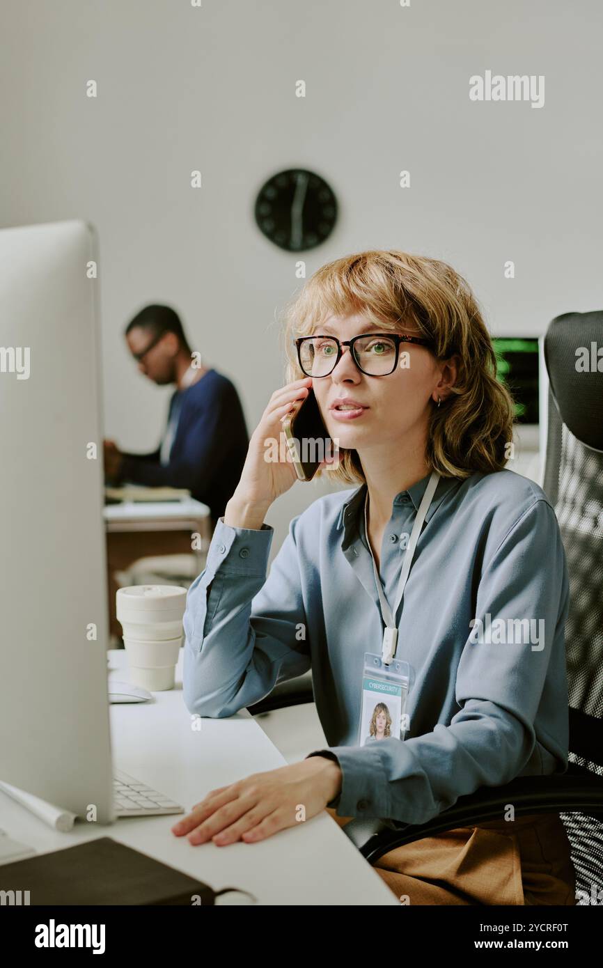 Female Specialist Talking On Phone Stock Photo