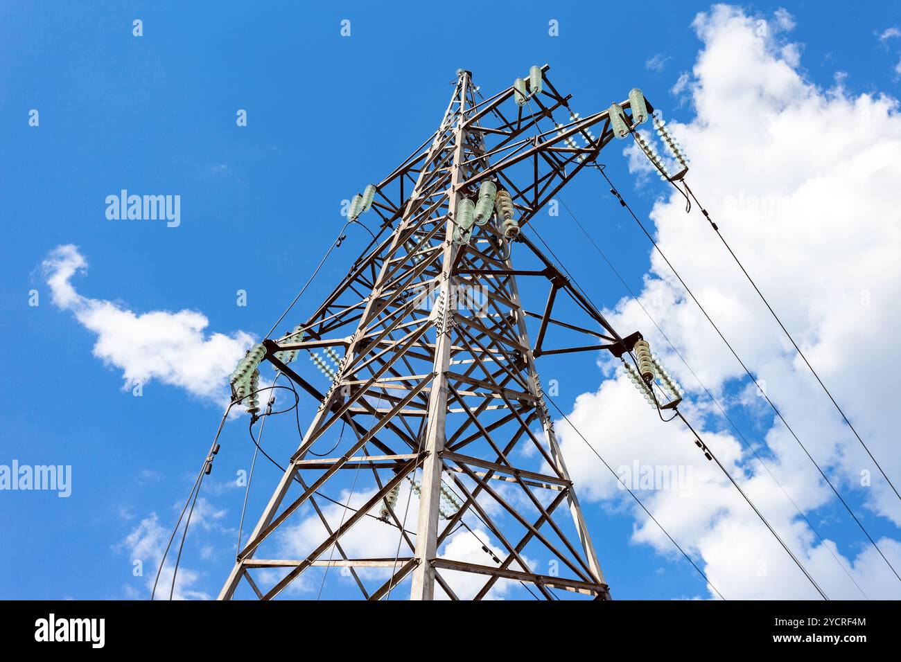 High voltage tower with ragged high-voltage line Stock Photo