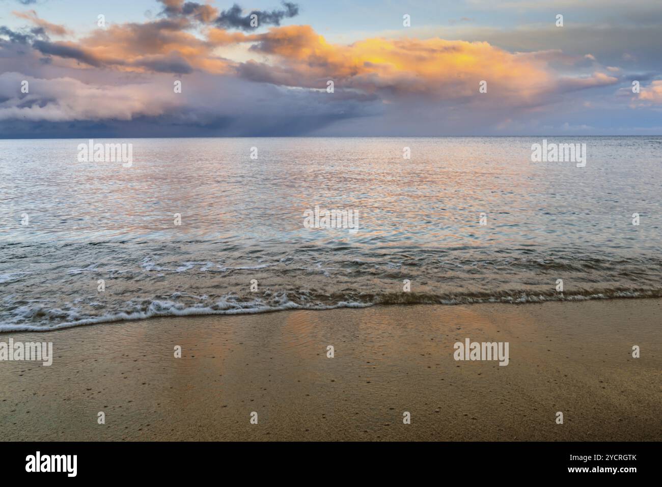 Beach sunset gentle waves hi-res stock photography and images - Alamy