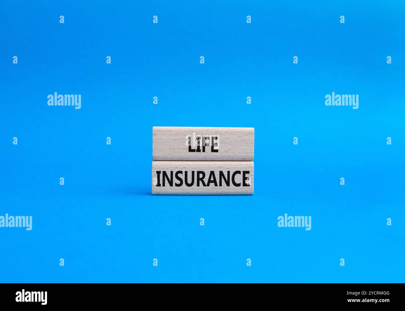 Life insurance symbol. Concept word Life insurance on wooden blocks. Beautiful blue background. Business and Life insurance concept. Copy space Stock Photo