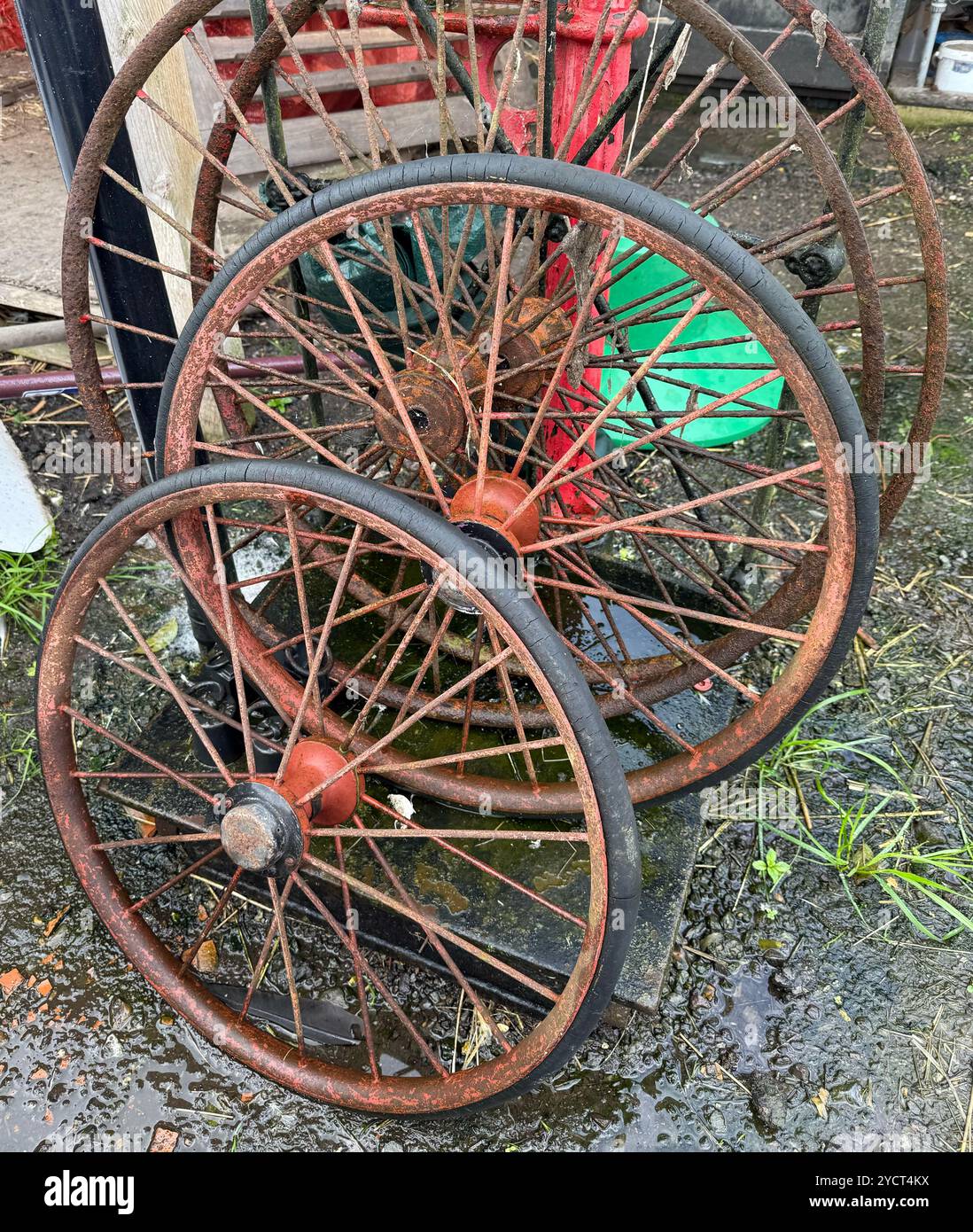Rusty Spoked Wheels in an Reclamation Yard - Smartphone Captured Stock Image Rusty Spoked Wheels in an Reclamation Yard - Smartphone Captured Stock Image