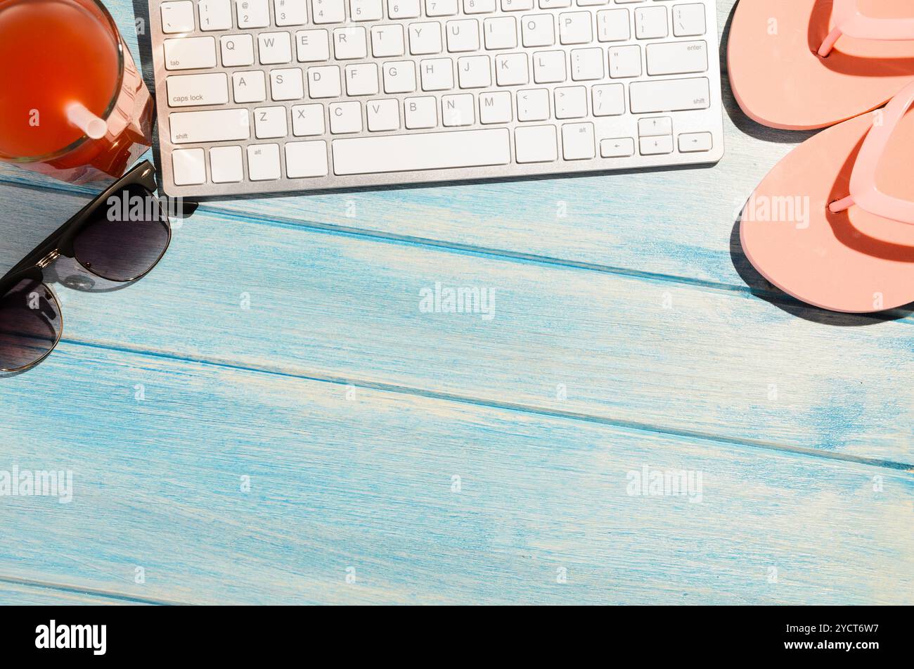Keyboard on beach table Stock Photo - Alamy