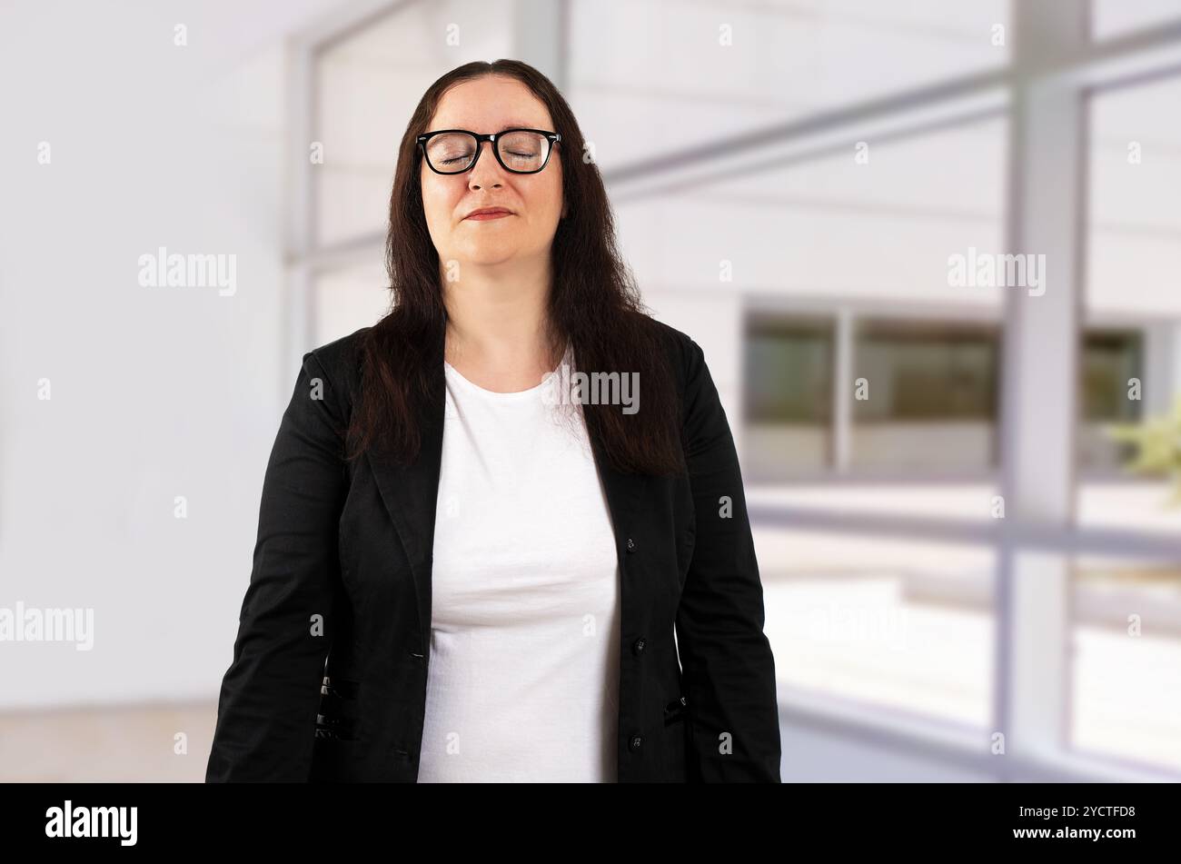 Finish, calm woman with business in office for task achievement, good news or job done. End, relax or happy consultant with eyes closed or confidence Stock Photo