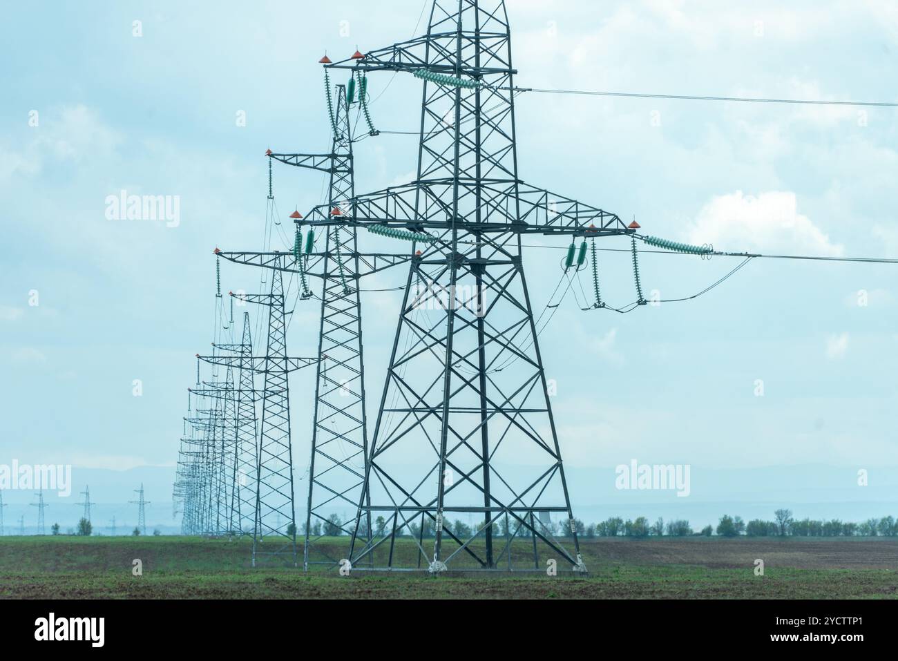 High voltage towers with sky background. Power line support with wires ...