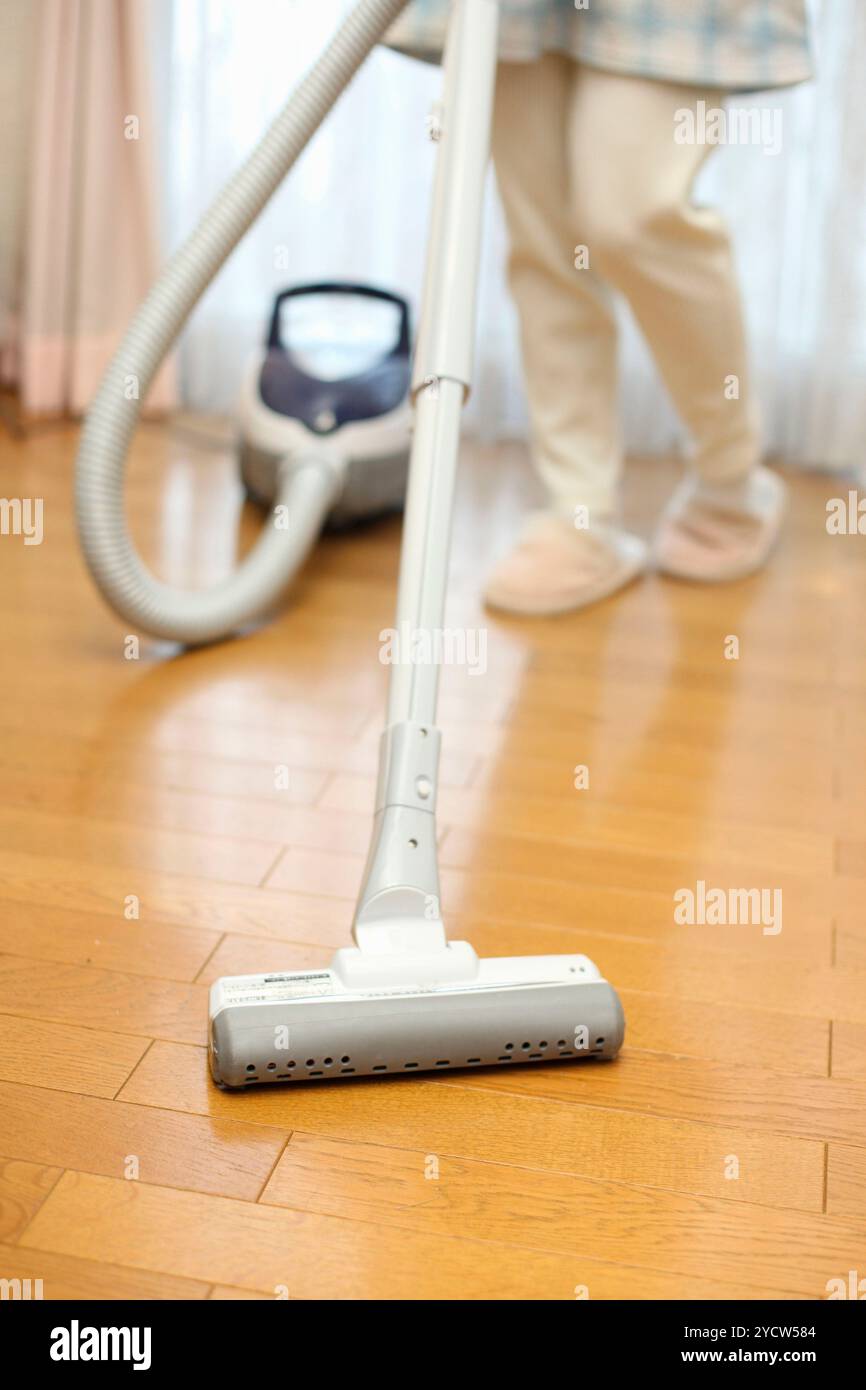 Woman vacuuming Stock Photo
