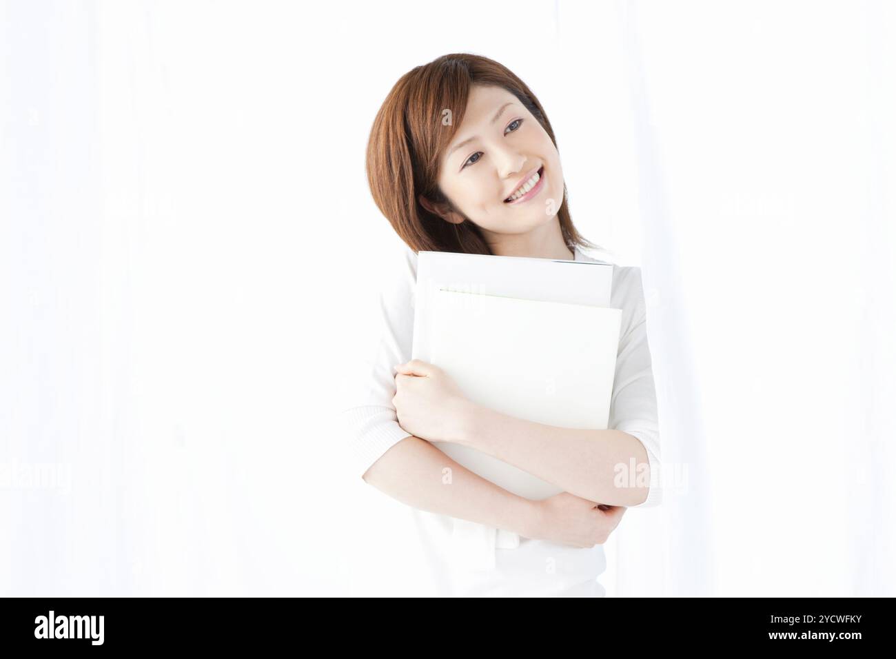 Woman holding a book Stock Photo