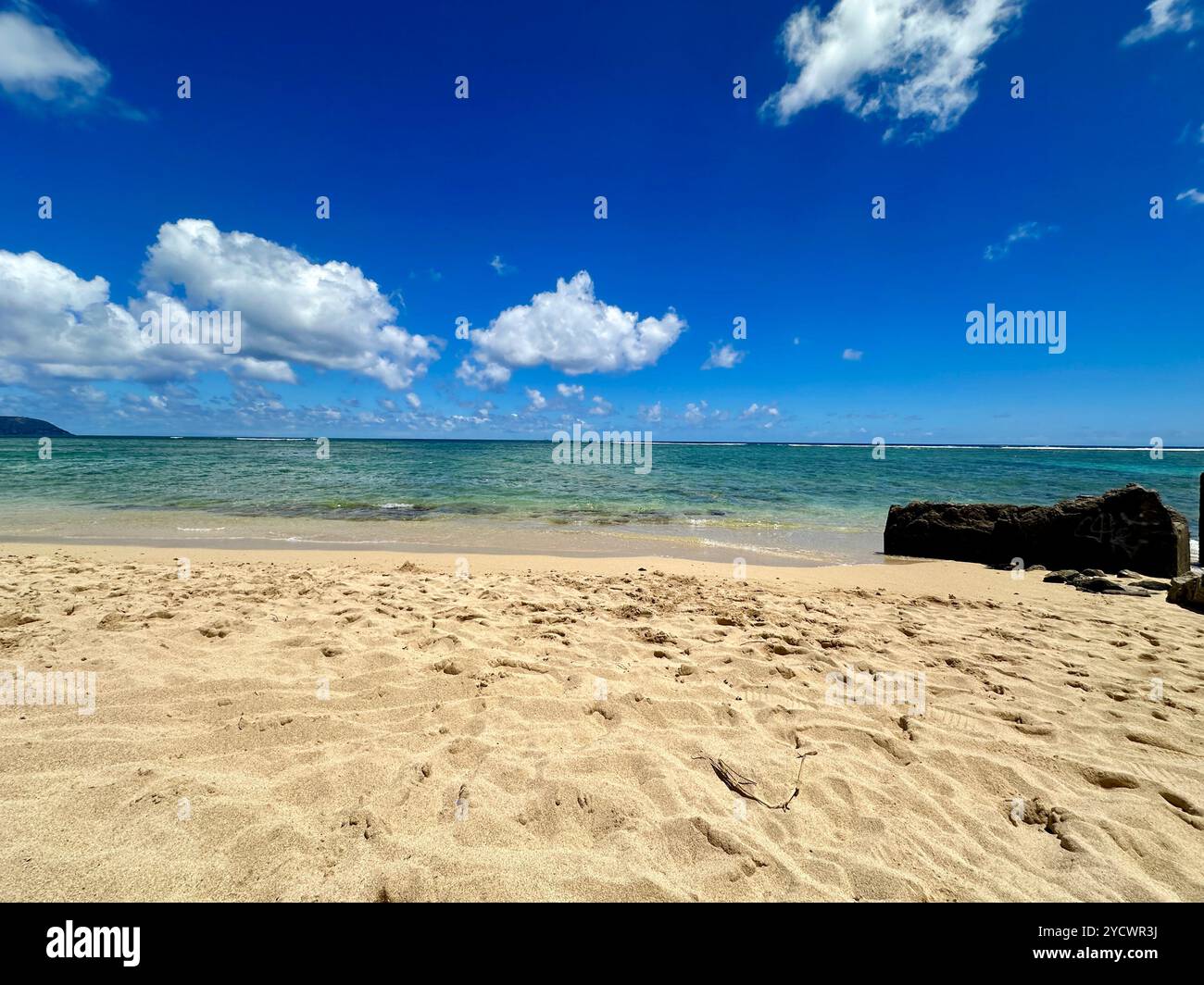 Tranquil Honolulu Escape: A peaceful Hawaiian beach scene - Smartphone Captured Stock Image