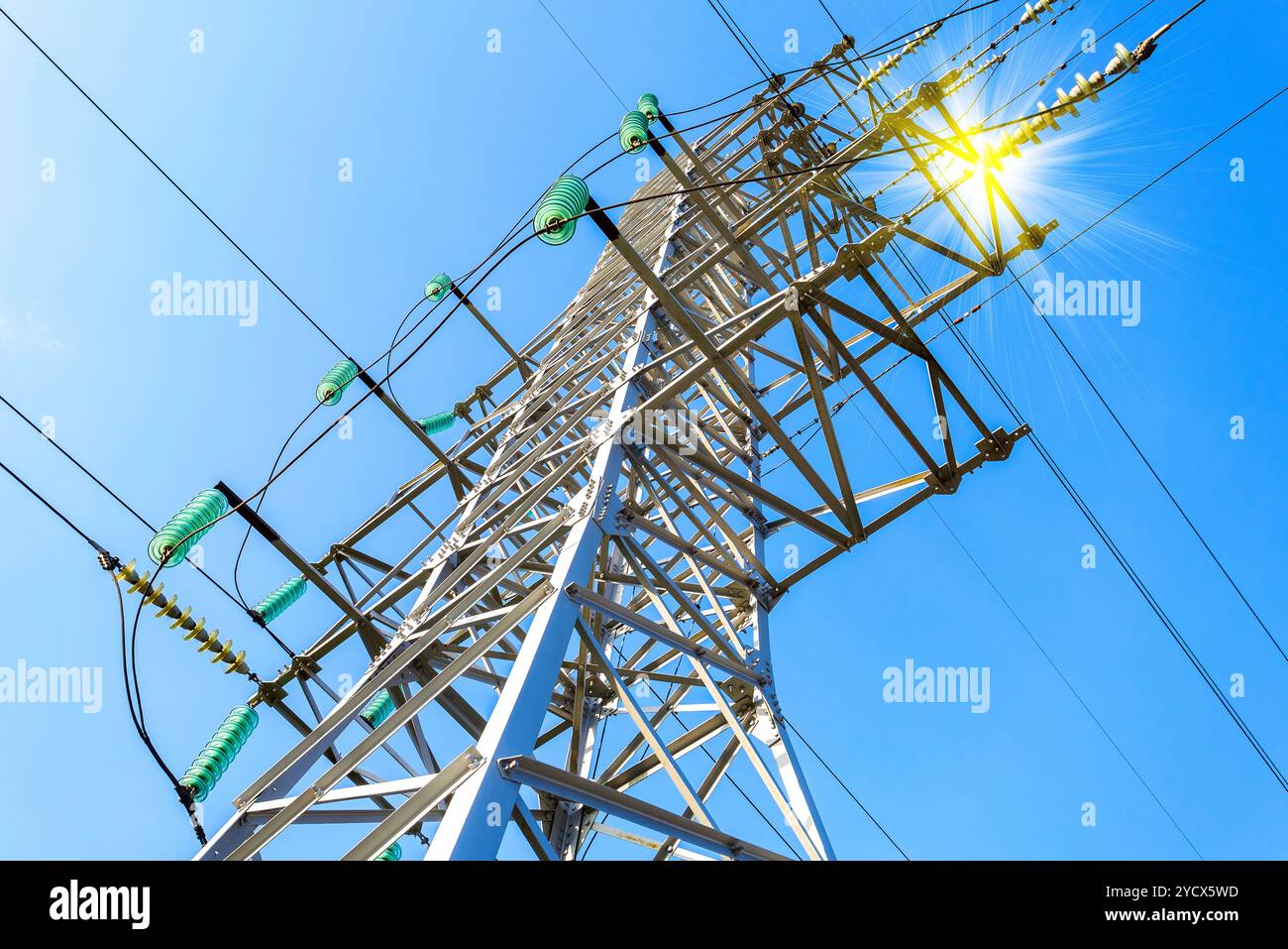 High voltage electric tower against the blue sky. Power transmission ...