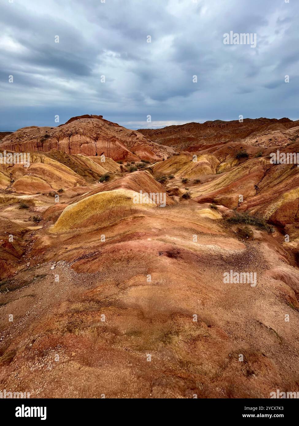 Explore the vibrant colors and surreal rock formations of Skazka Canyon, Kyrgyzstan—a hidden gem in Central Asia’s rugged landscapes. #SkazkaCanyon - Smartphone Captured Stock Image
