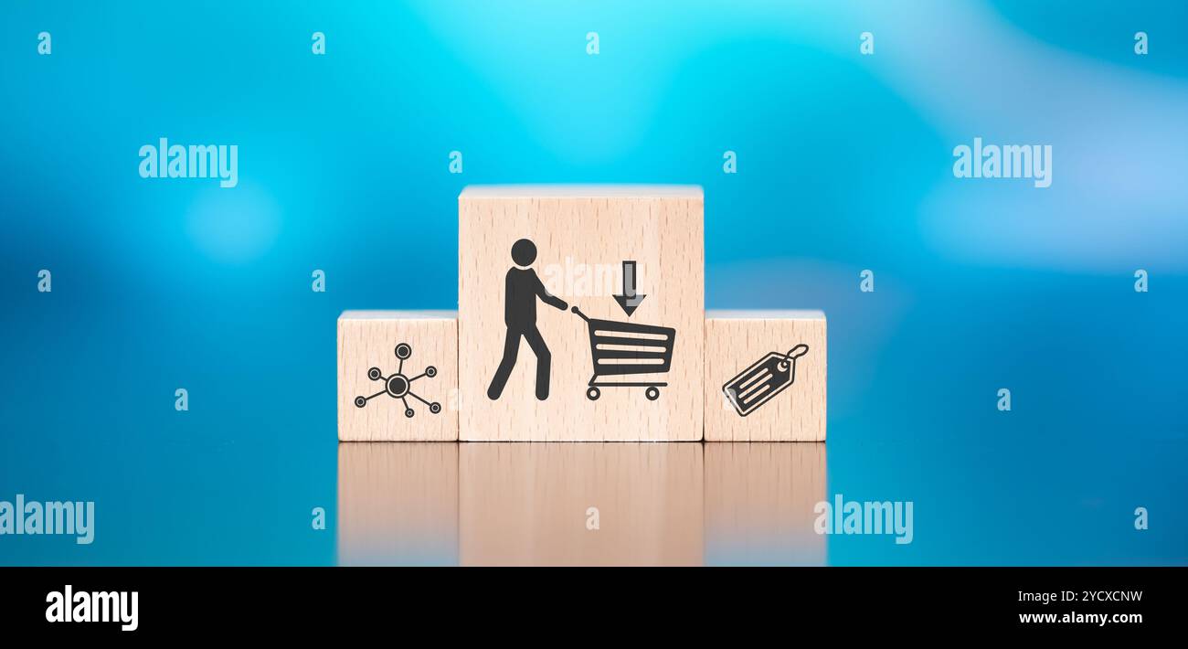 Wooden blocks with symbol of purchase concept on blue background Stock Photo