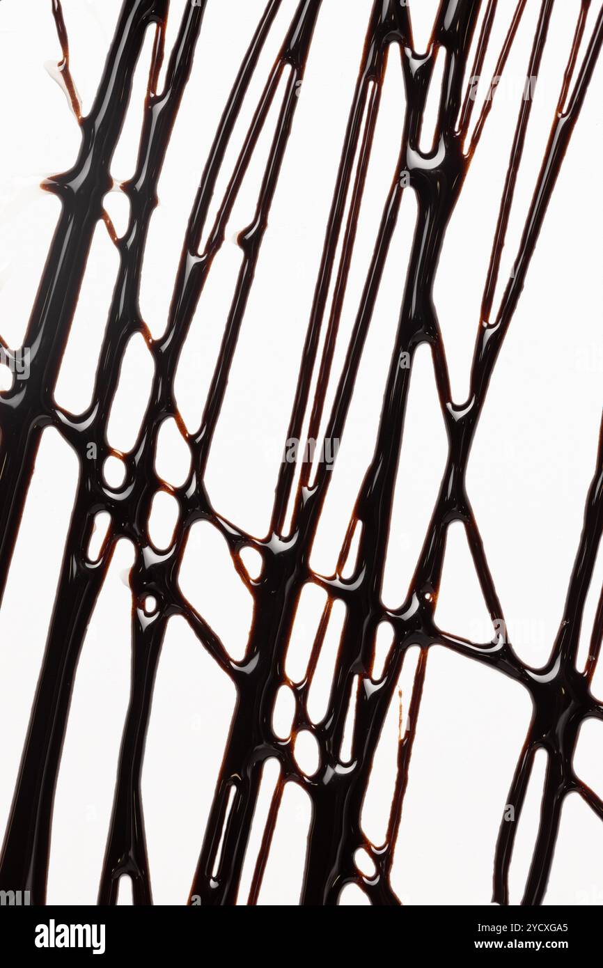 Top view of drizzled dark chocolate syrup creating a complex vertical ...