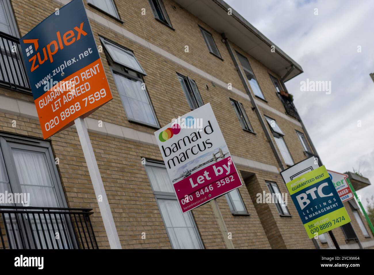 Rent and For Sale boards outside a residential property in North London, England United Kingdom Stock Photo