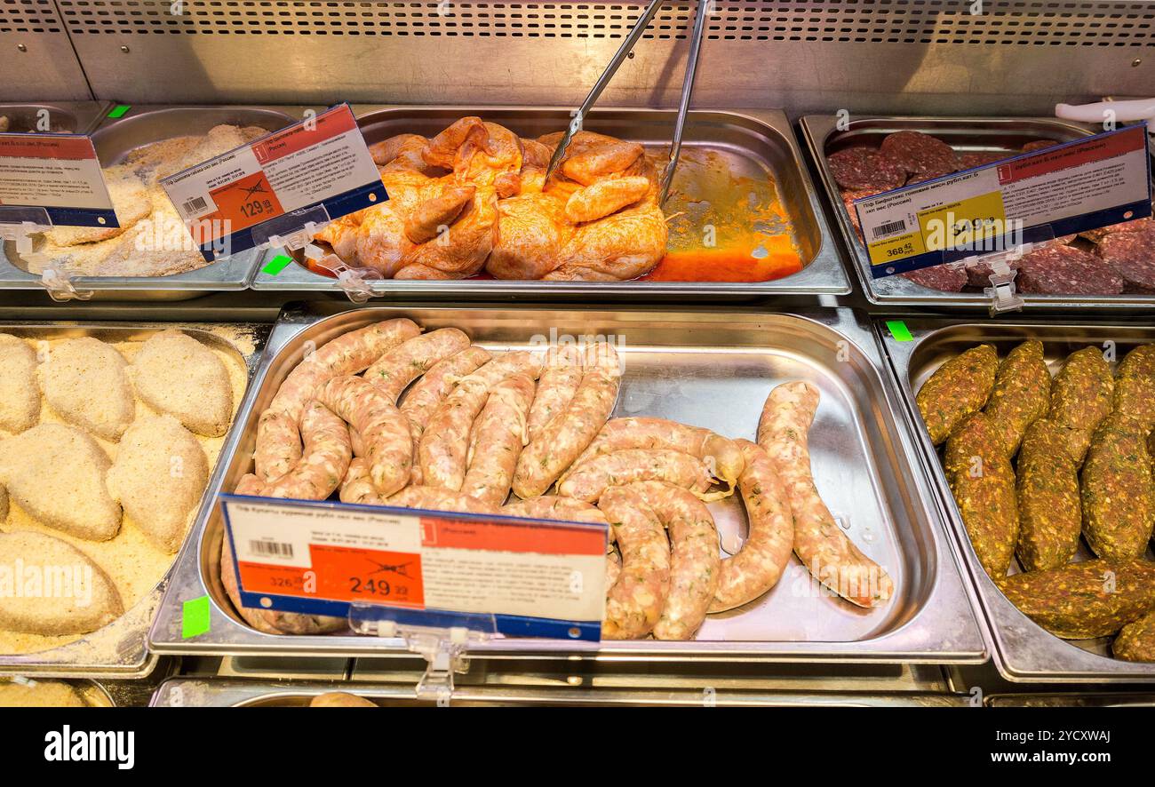 Showcase with different grades of meat and sausages in shop stock photo
