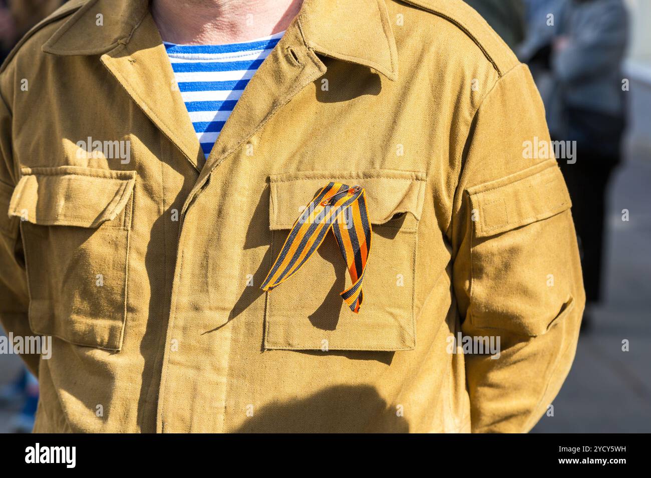Black and orange ribbon of St. George on a veteran military uniform ...