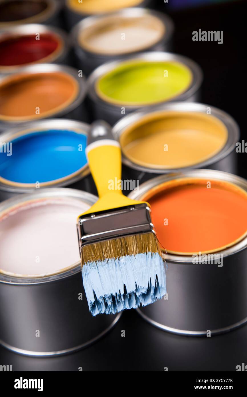 Tin cans with paint and brushes Stock Photo