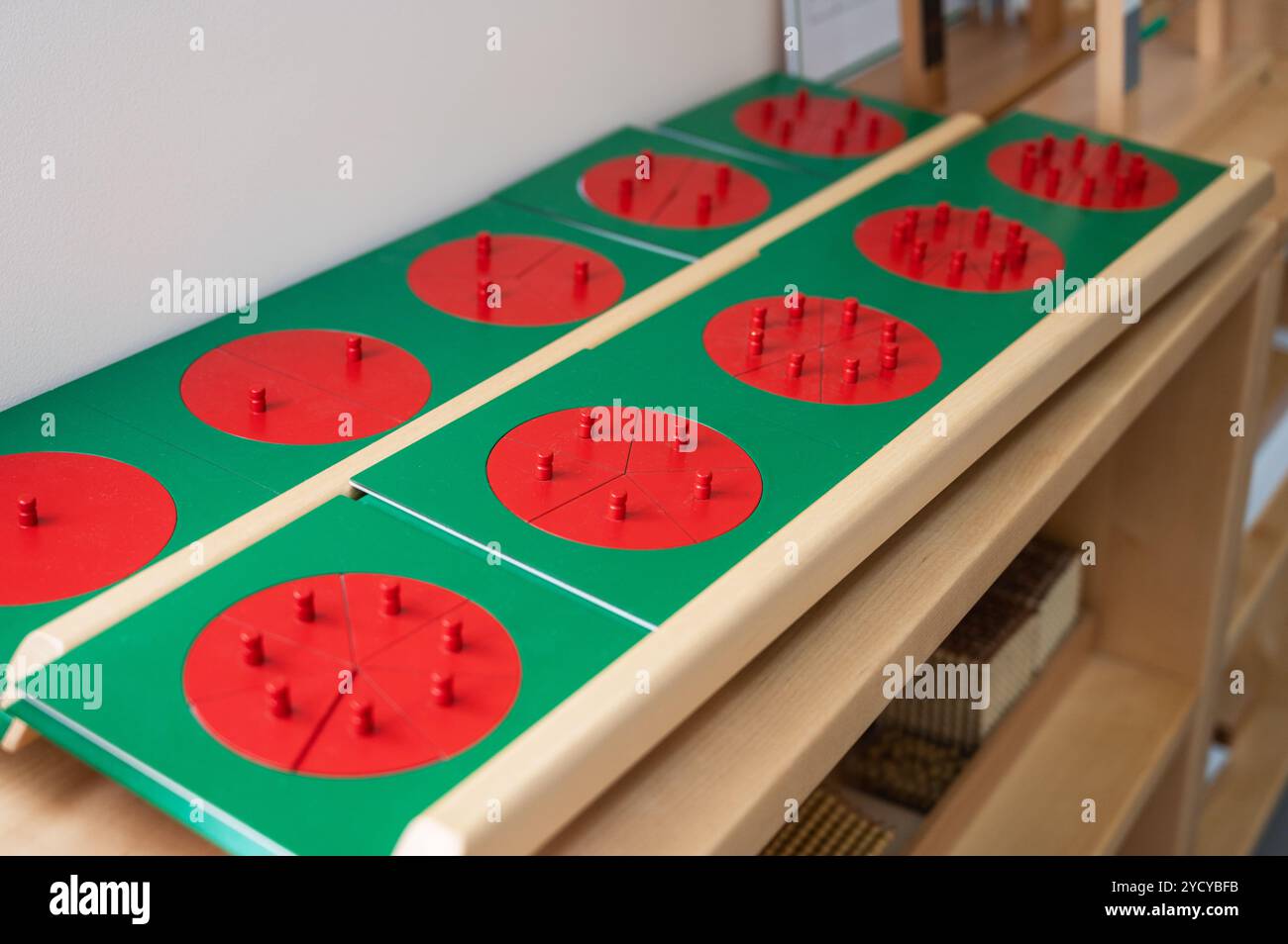 Educational fraction learning tools featuring red circle segments on ...