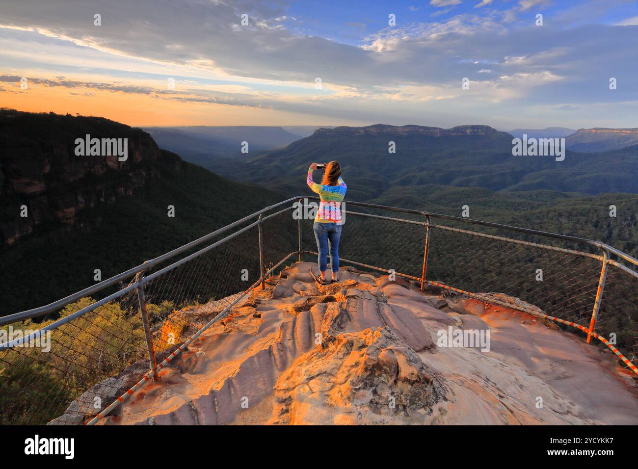 Capturing a photo of sunrise mountain lookout Stock Photo - Alamy