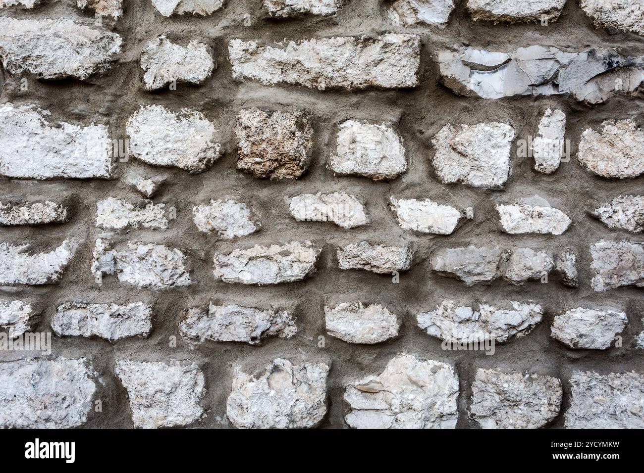 Rough stone wall as creative background texture Stock Photo