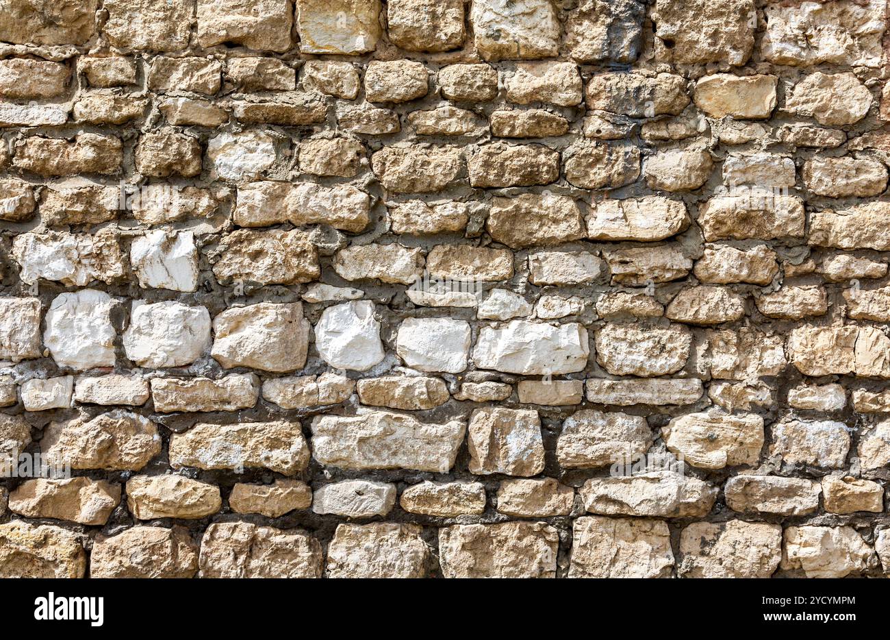 Rough stone wall as creative background texture Stock Photo