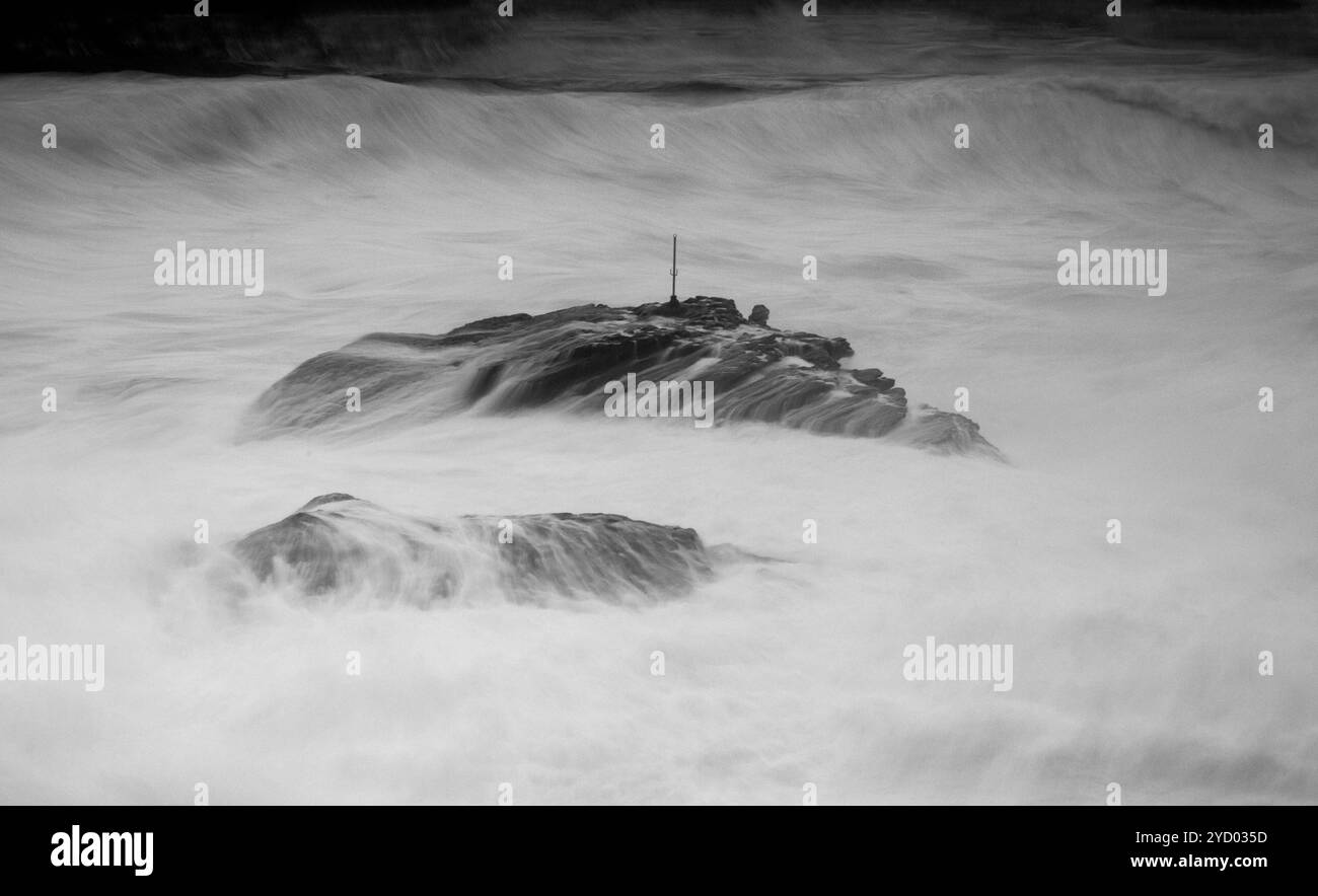 Rock fighting to stay above the huge swells Cape Banks Australia Stock Photo