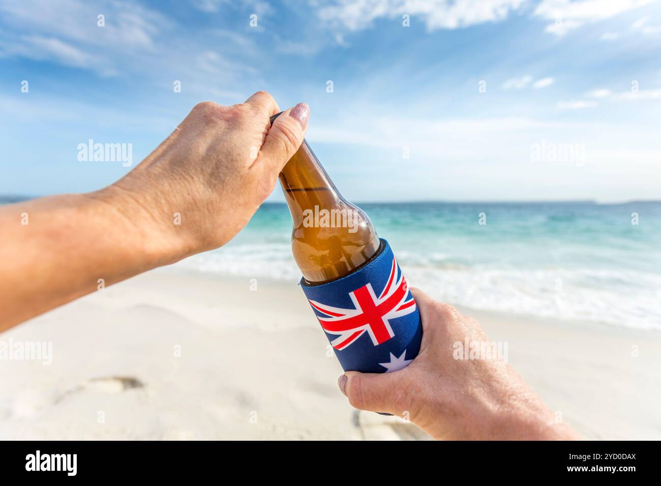 Beach party holiday mode, open a cold beer on beach Stock Photo
