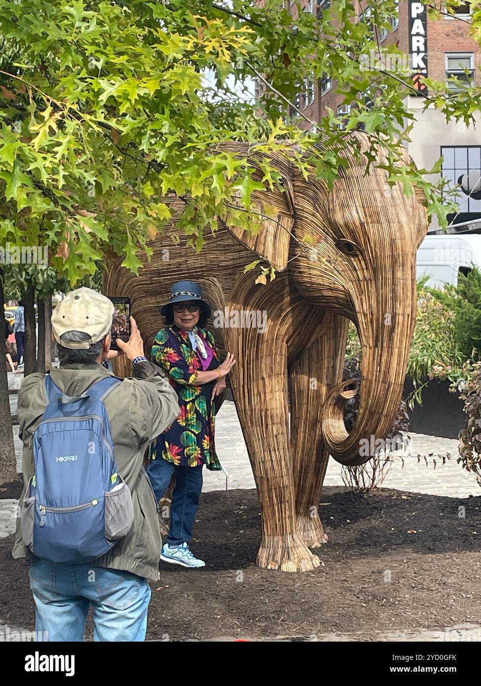 The great elephant migration public art display features elephants made from invasive weeds to highlight conservation projects, 2024, NYC, USA - Smartphone Captured Stock Image