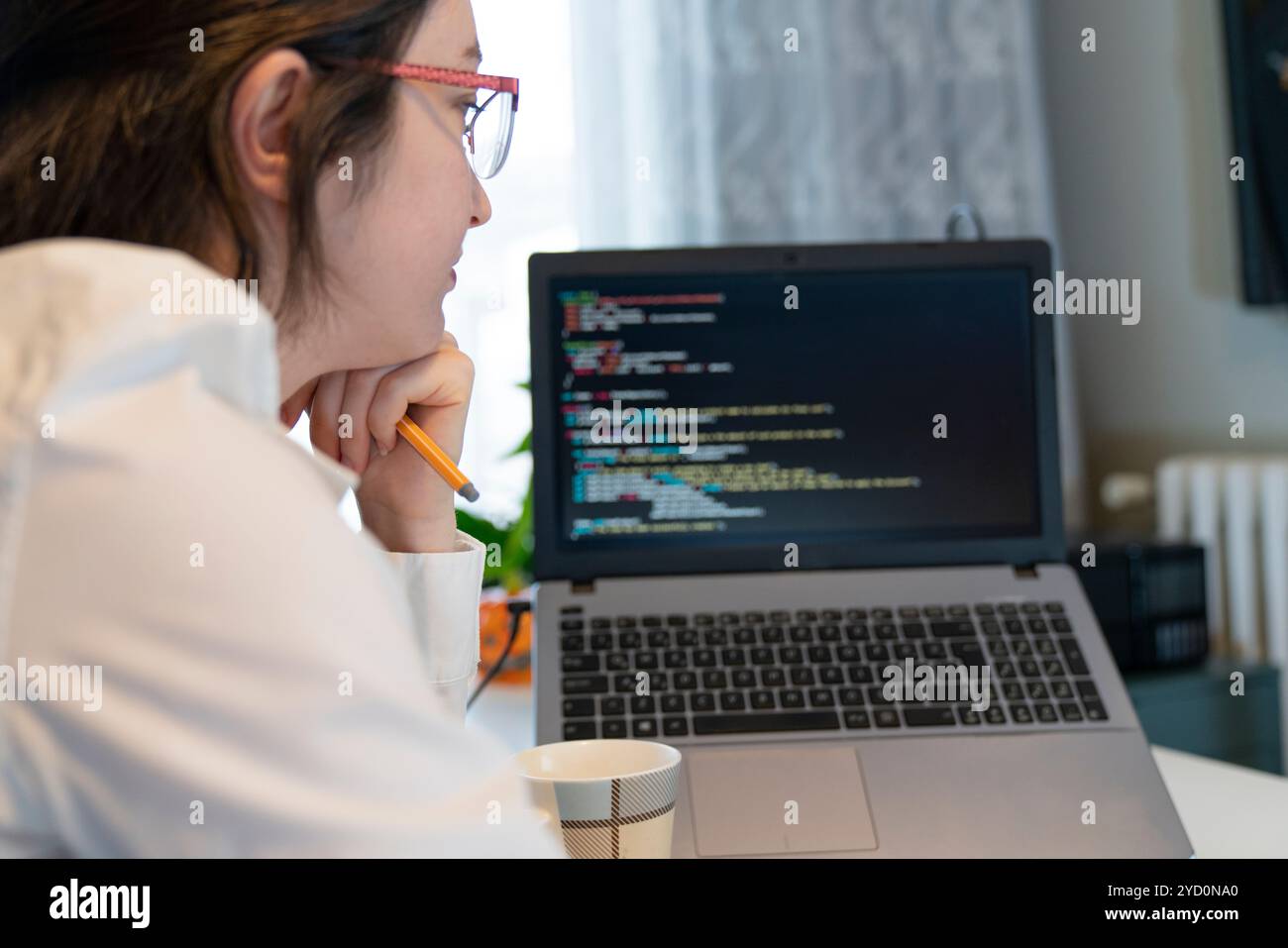 Woman Working And Programming On Computer In Office.woman working on coding on laptop Stock Photo