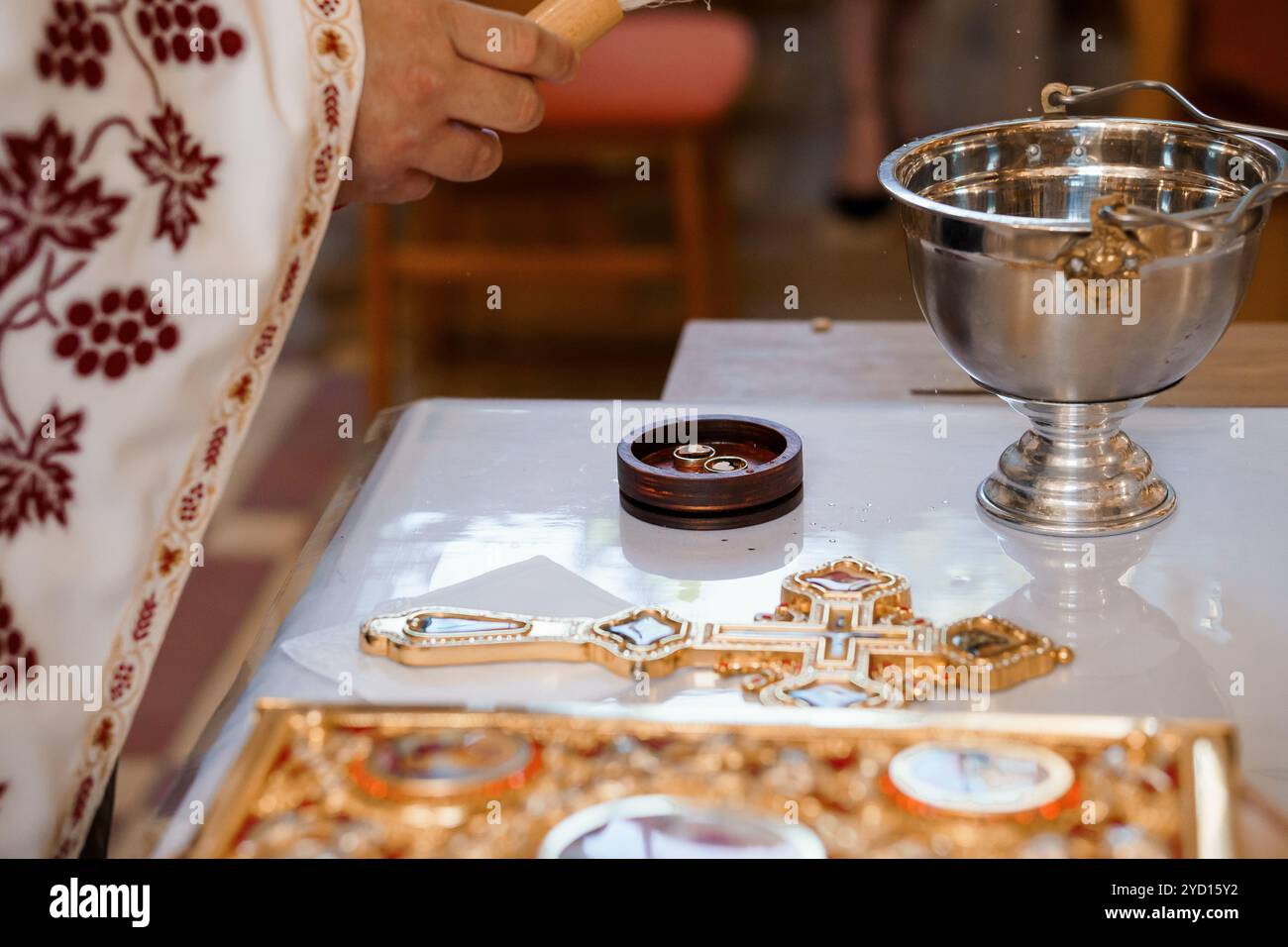 Sacred Ritual of Blessing with Cross and Chalice Stock Photo - Alamy