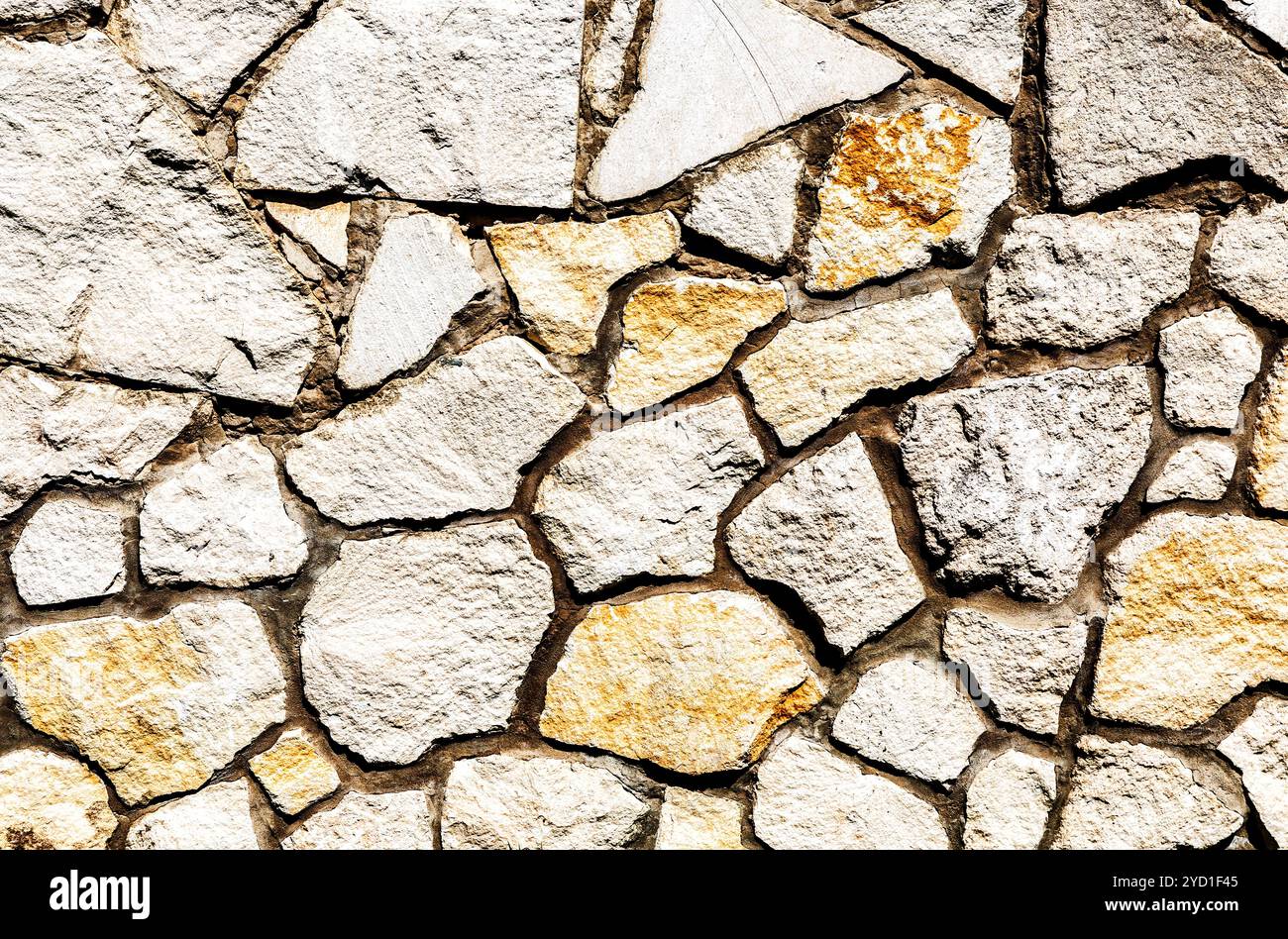 Weathered stone wall as background texture Stock Photo