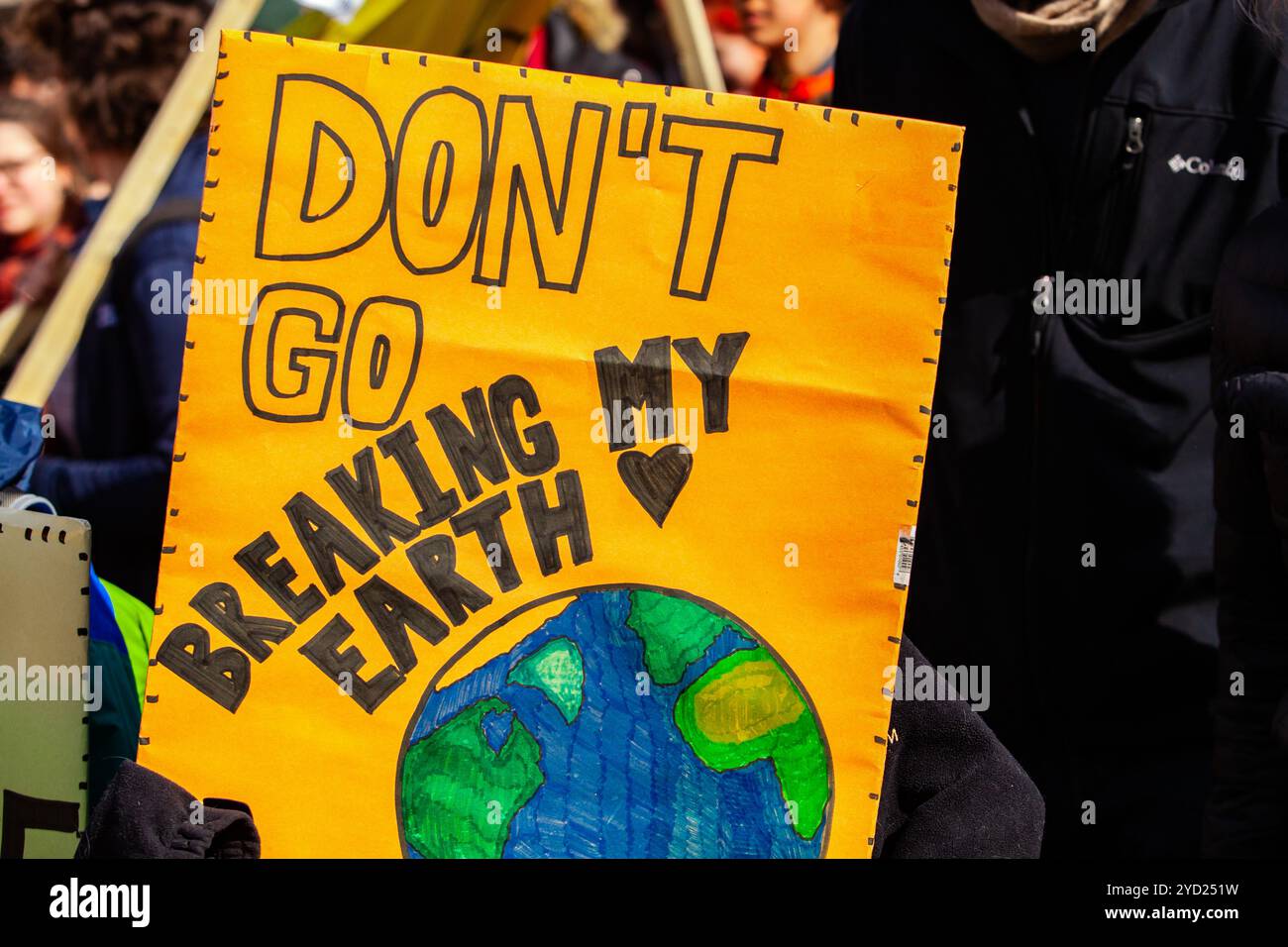 Ecological activist holds sign at rally Stock Photo - Alamy