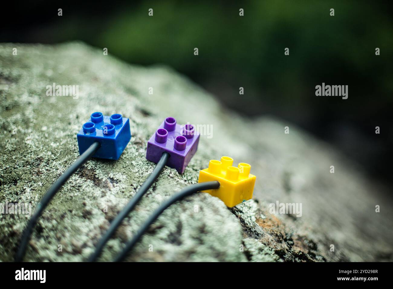 Construction blocks on rock Stock Photo - Alamy
