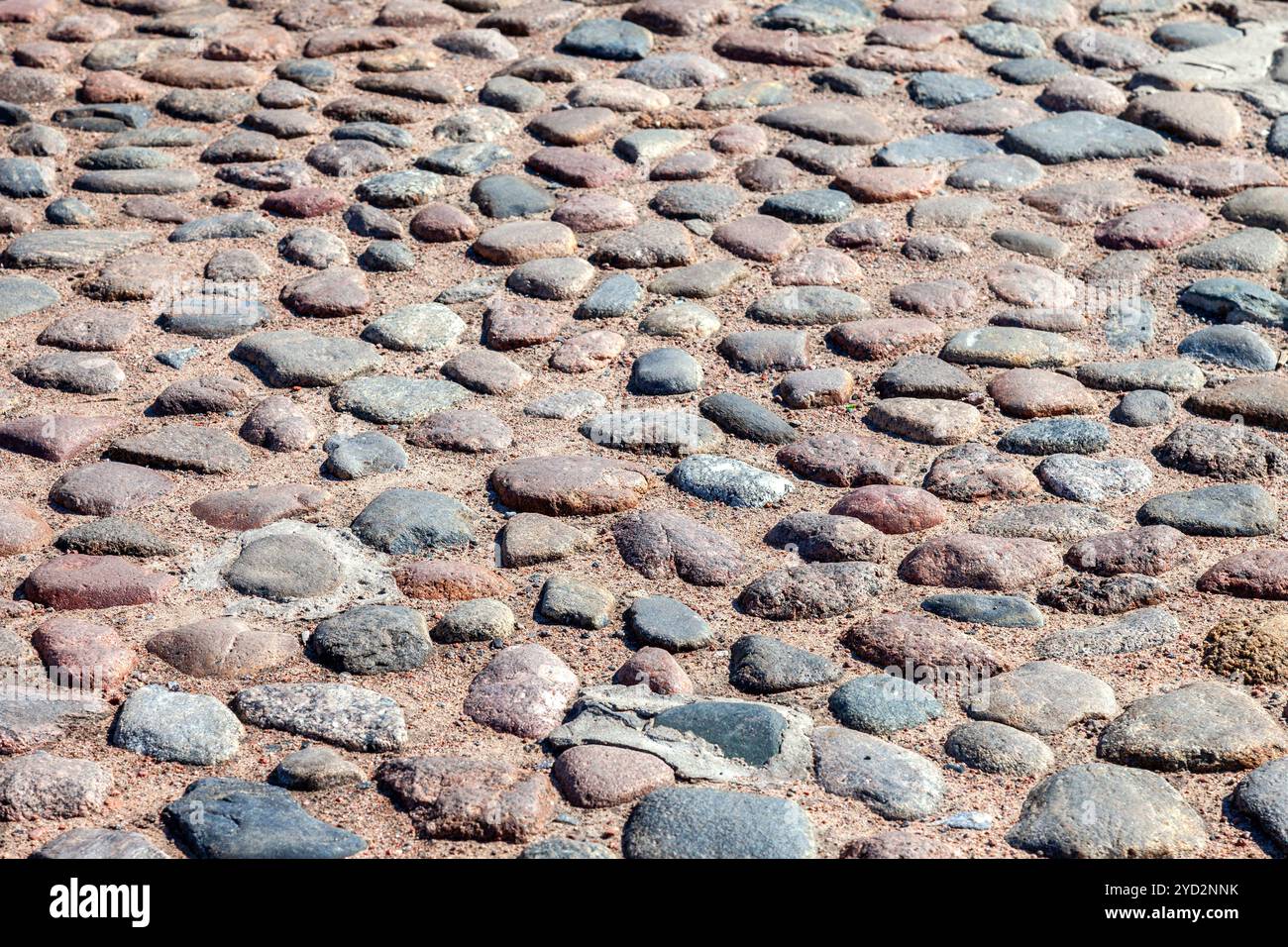 Old cobblestone pavement as creative background Stock Photo