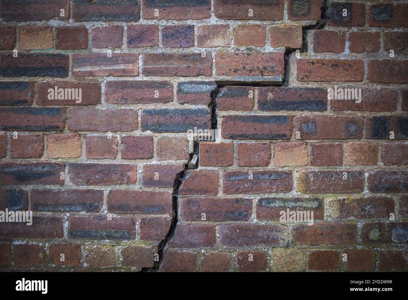 A Large Crack In An Old Red Brick Wall Stock Photo