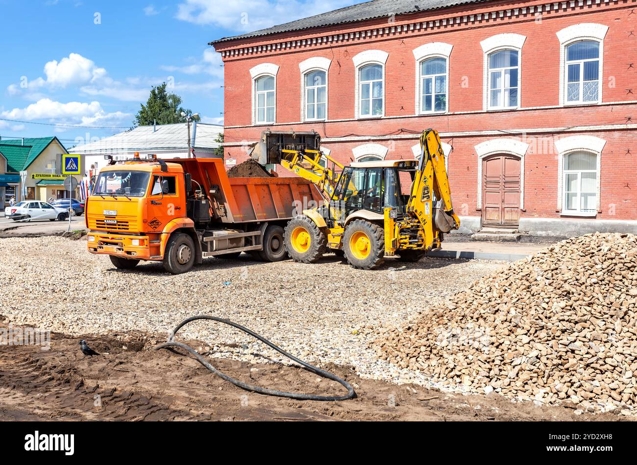 Front loader working on the construction of new road Stock Photo - Alamy