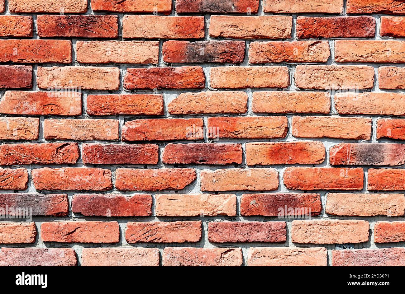Old weathered red brick wall as background Stock Photo