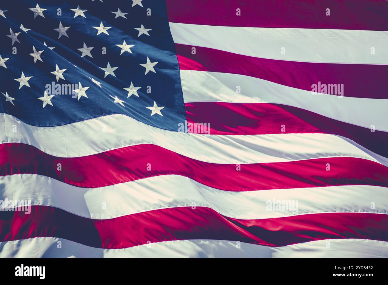 Retro Filtered Image Of A American Stars And Stripes Flag Flying In The Breeze Stock Photo