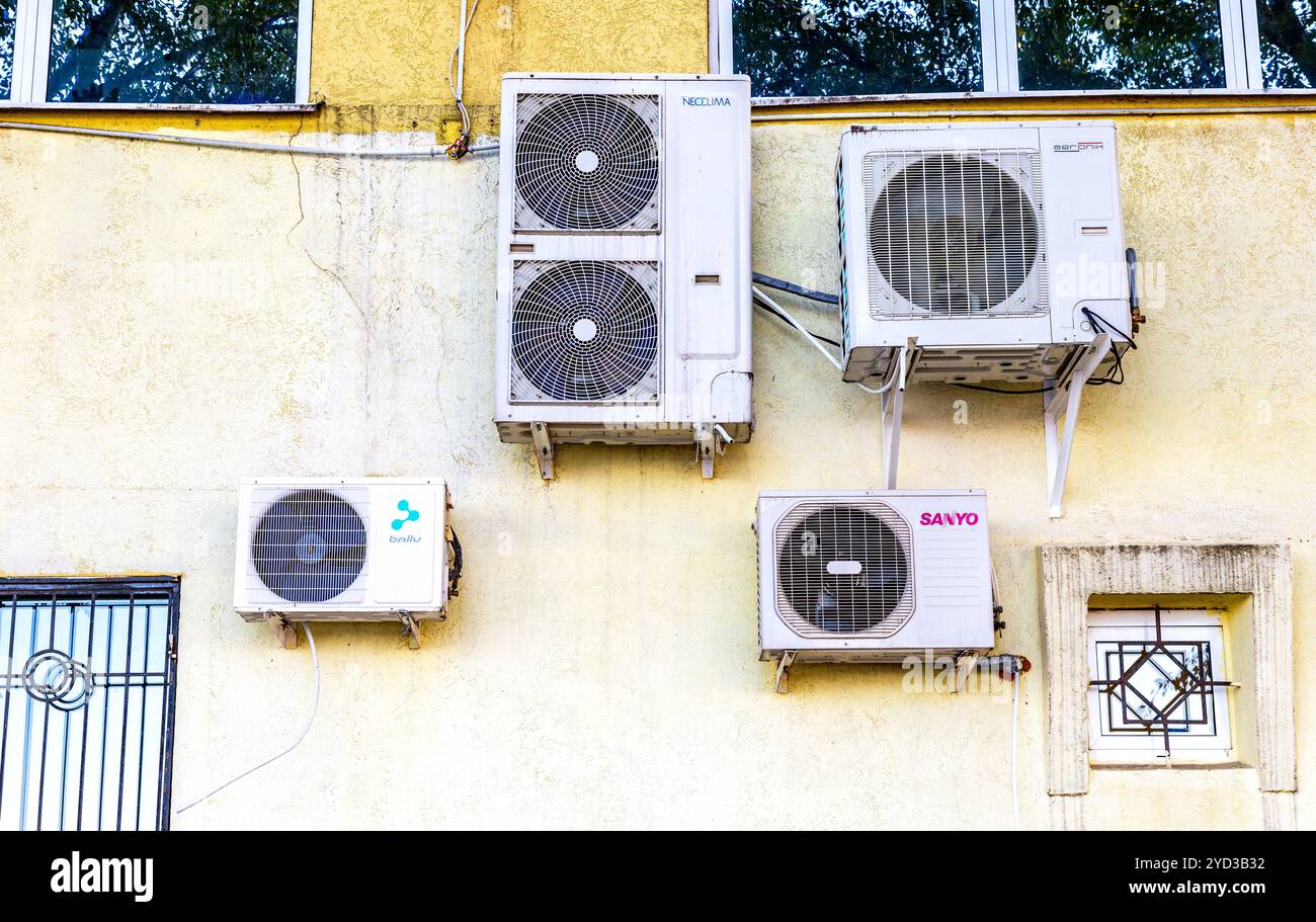 Different air compressors hanged on the wall Stock Photo - Alamy