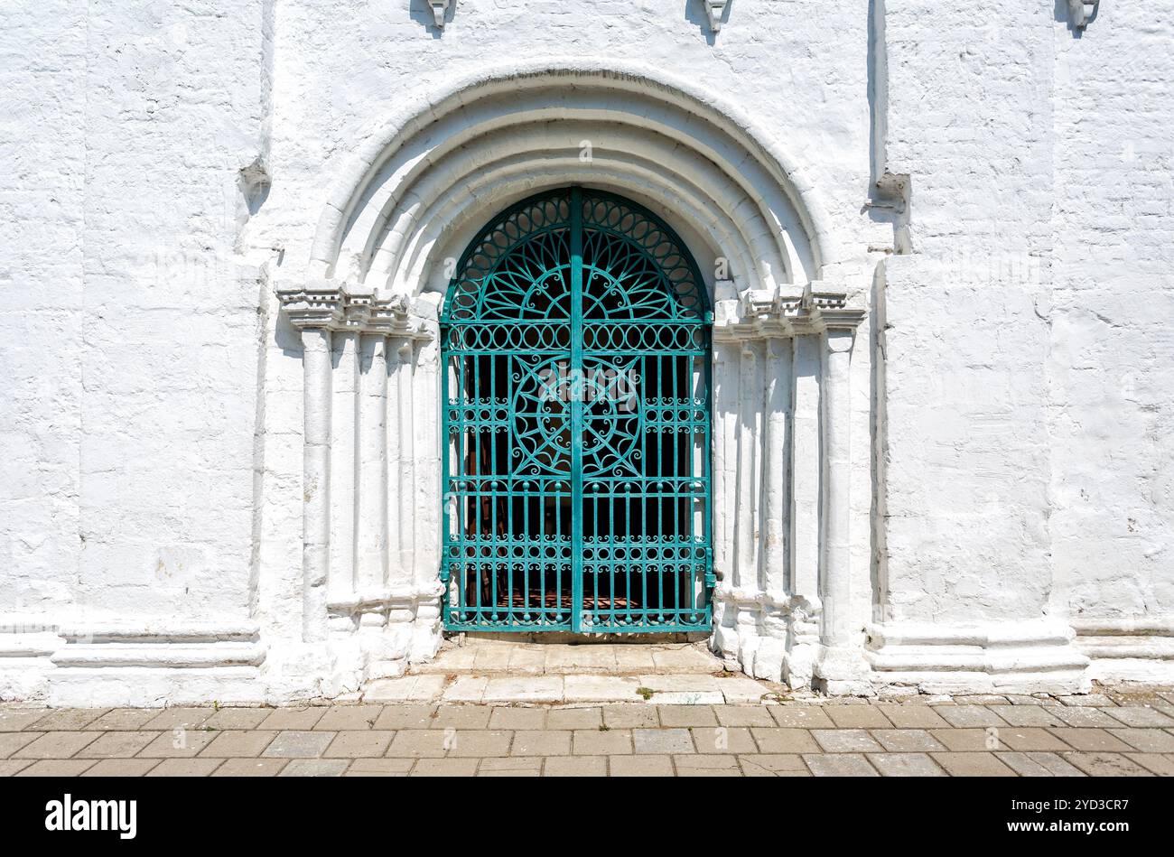 Old cathedral forged metal gate with door knobs Stock Photo