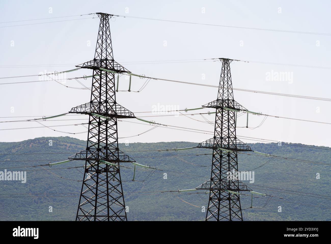 High voltage towers with sky background. Power line support with wires ...