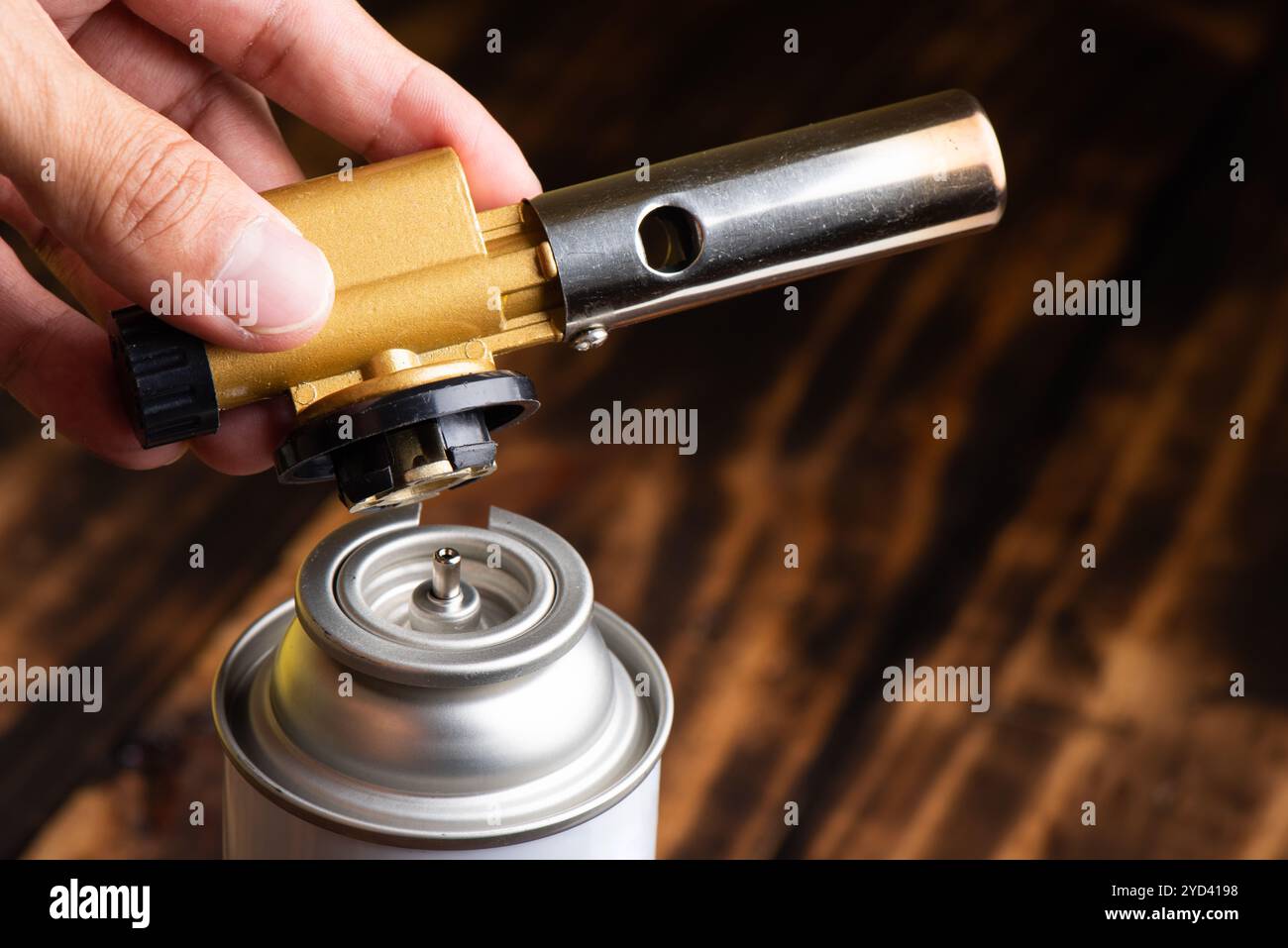 Man Using Blowtorch The man connecting blowtorch to gas bottle. Blowtorch or gas torch ...