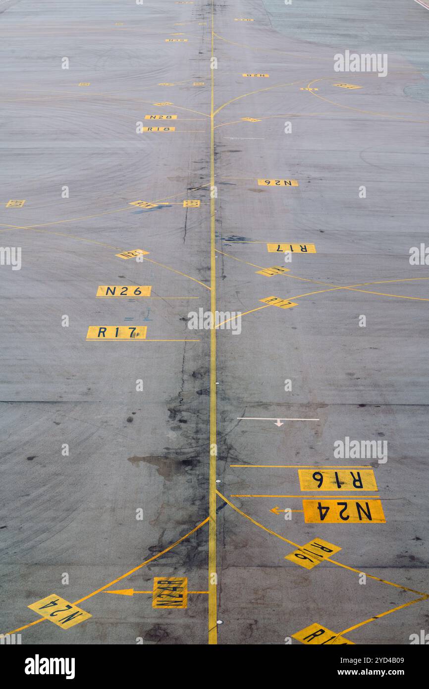 Wayfinding lines on the tarmac at hk international airport stock photo