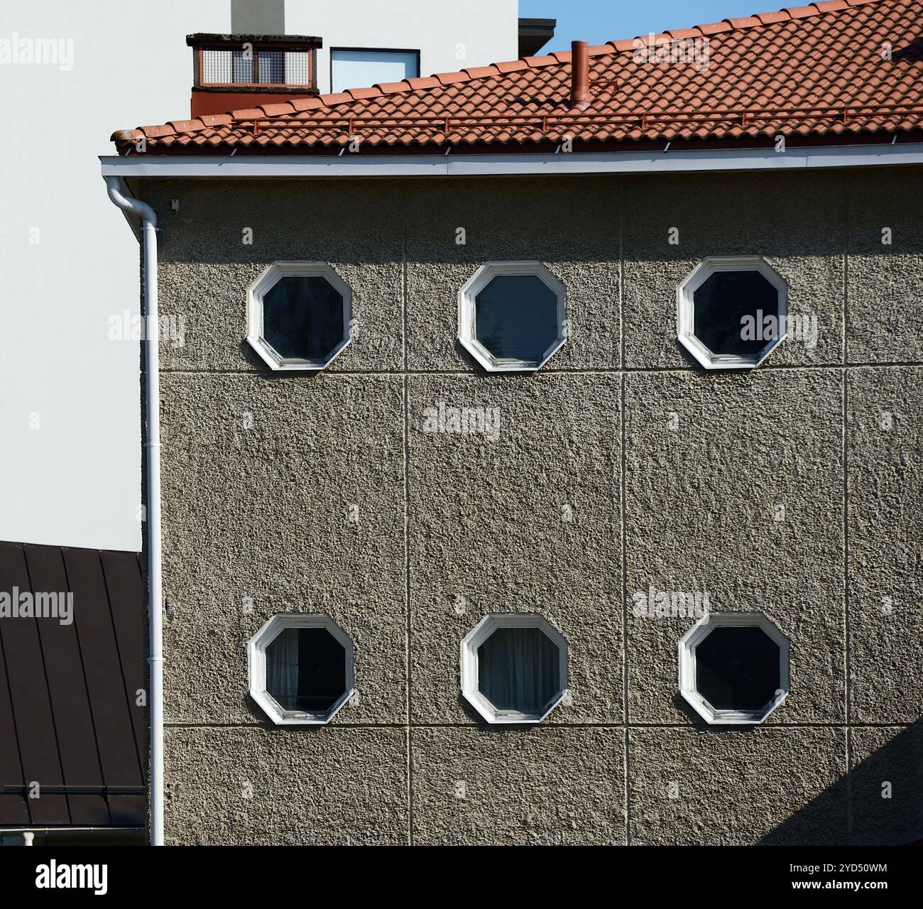 House facade with octagonal windows Stock Photo