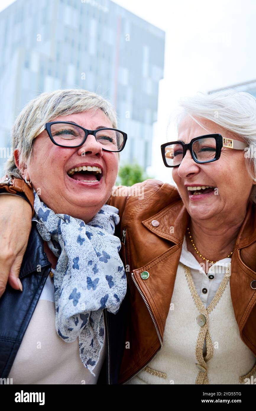 Two women standing together hi-res stock photography and images - Alamy
