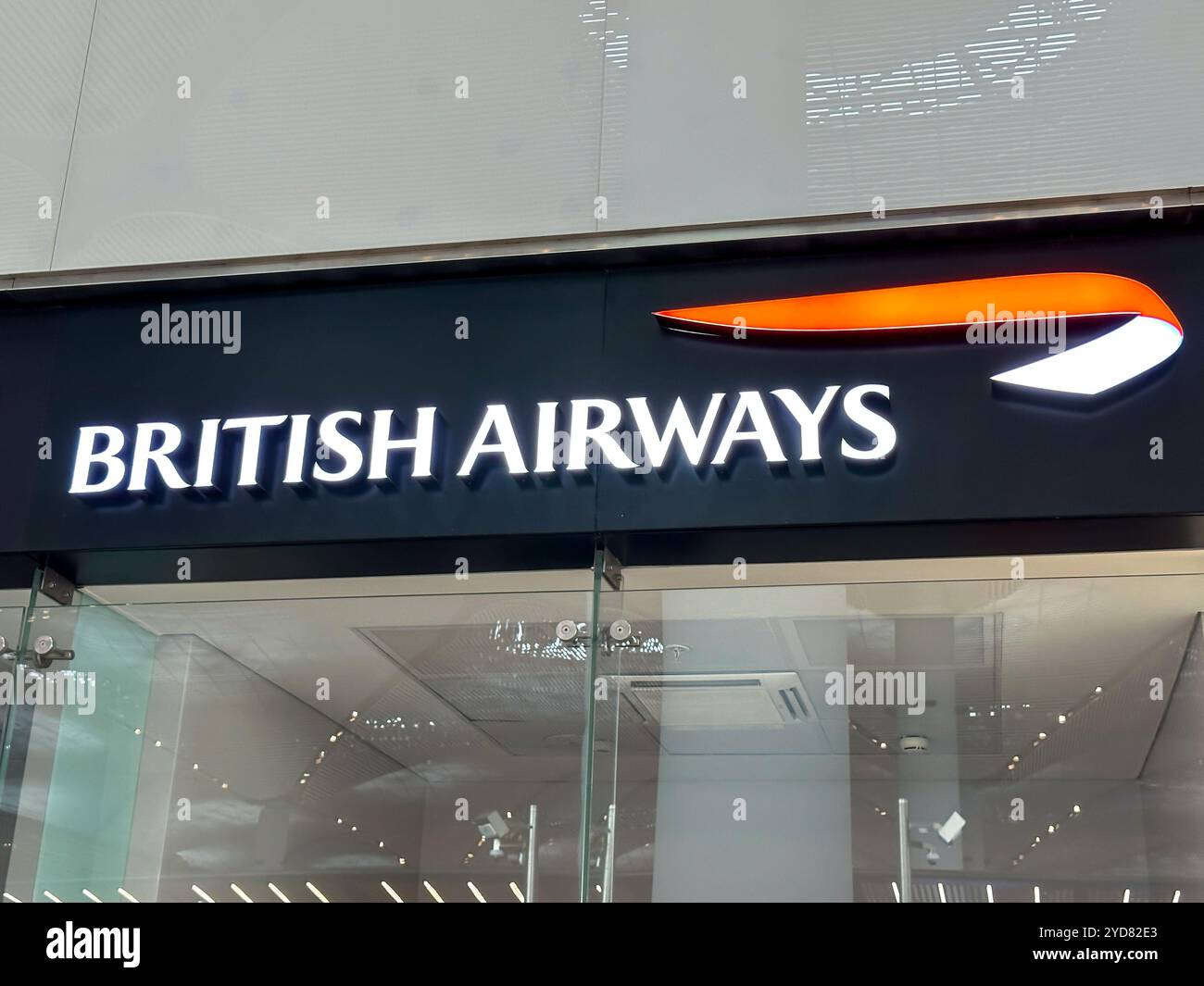 Istanbul, Turkey - April 19, 2024: A large blue illuminated logo sign reading British Airways in departures at Istanbul airport Stock Photo