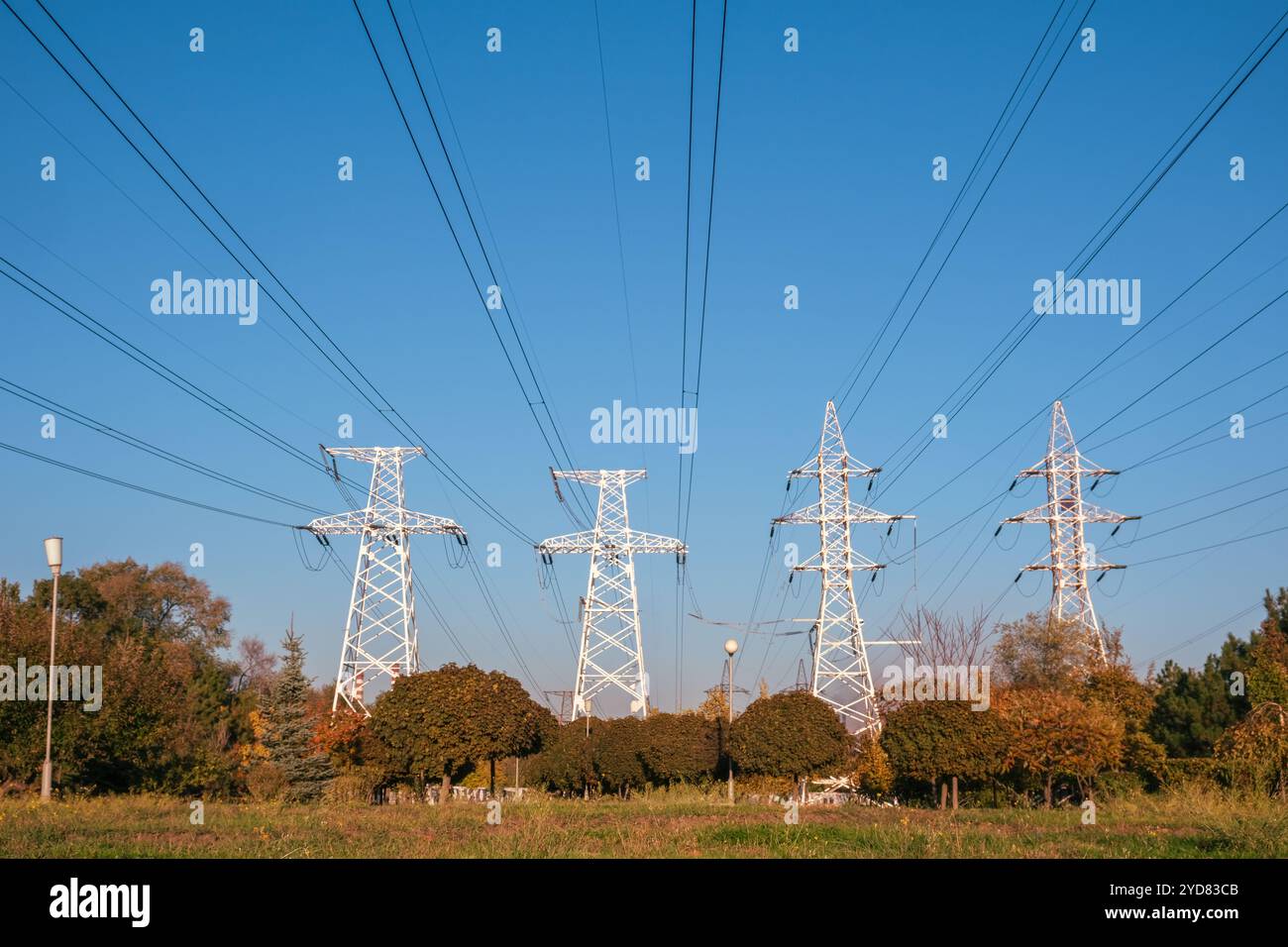 Power transmission lines and towers stand prominently against a clear ...